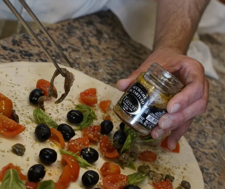 Anchovies with summer truffles, marinated in extra virgin olive oil 